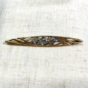 Art Deco style bar brooch, gold-tone & rhinestones.